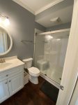 Full Bathroom at Bottom of Stairs from Twin Bedroom Next to Kitchen